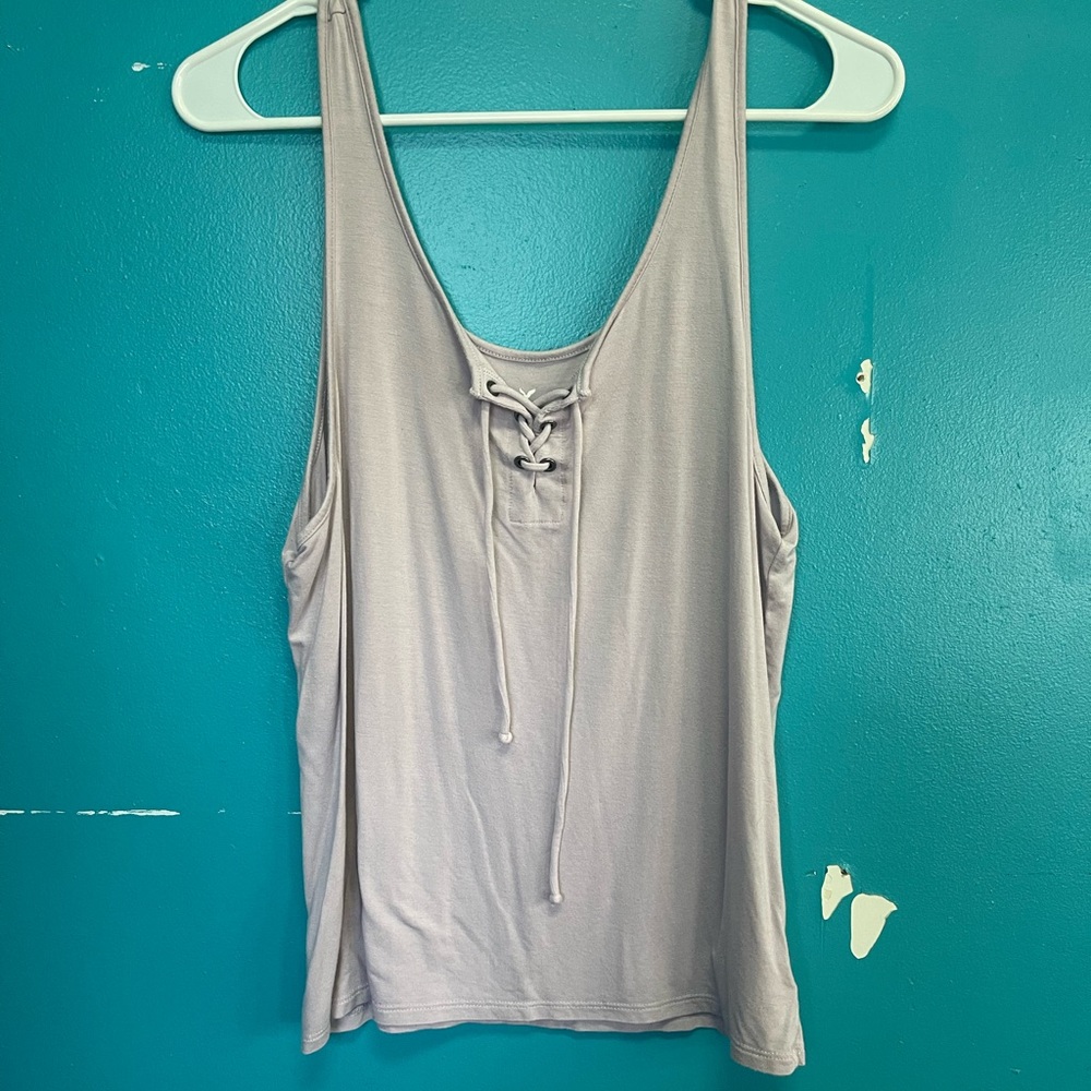 American Eagle lilac tank top with lace up.